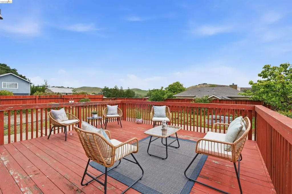 Expansive wood deck with a red-painted finish