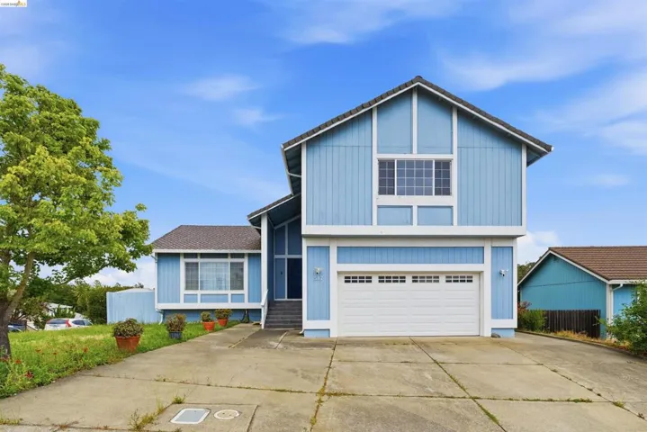 Two-story residence featuring blue siding and white trim