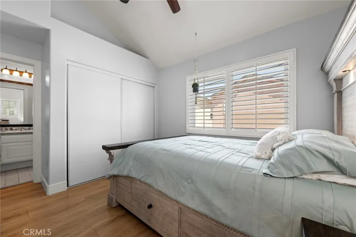 Bright secondary en-suite bedroom featuring vaulted ceilings and plenty of natural light