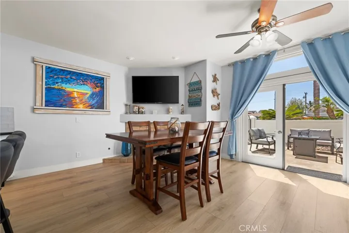 Open den and kitchen with French doors that extend living space to the inviting front courtyard patio