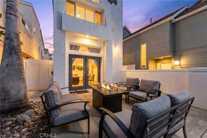 Evening fire pit seating area designed for warm, intimate entertaining at twilight