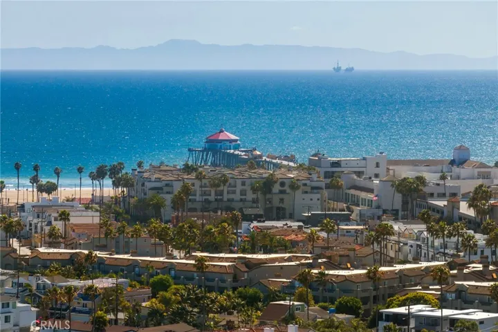 Stunning aerial view capturing Huntington Beach Pier, the Pacific Ocean, and Catalina Island on the horizon