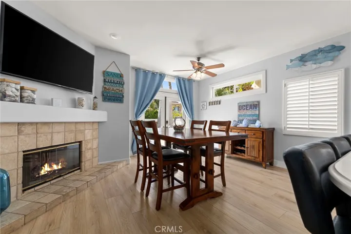 Warm and inviting den centered around a cozy fireplace, ideal for relaxing or entertaining