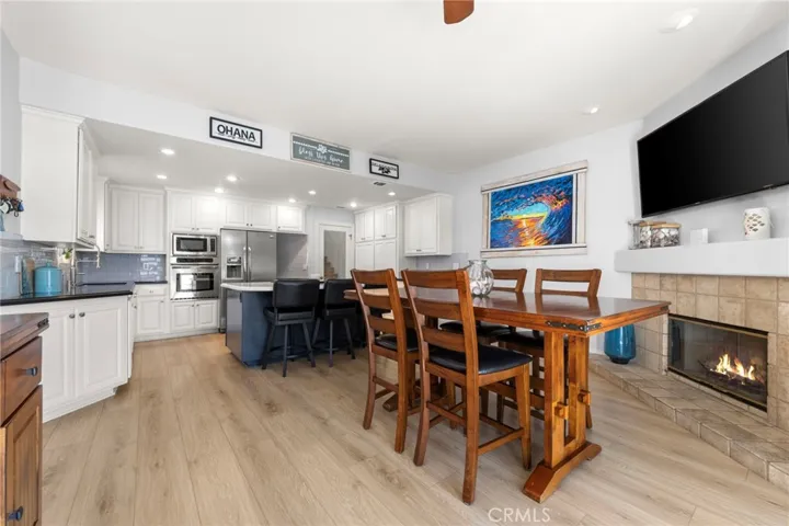 Light-filled open concept den and kitchen with seamless flow for everyday living and entertaining