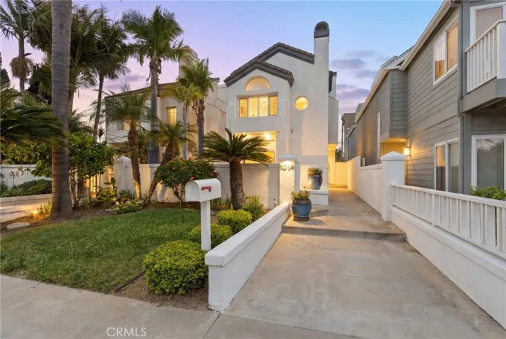 Elegant twilight curb appeal highlighting the home’s exterior presence