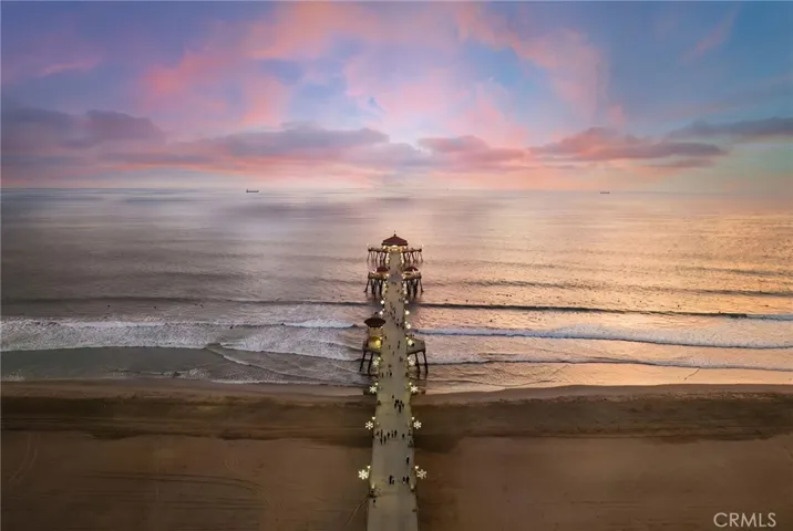 Beautiful twilight view of Huntington Beach Pier glowing along the Pacific coastline