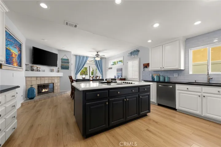 Spacious open concept den and kitchen designed for modern living