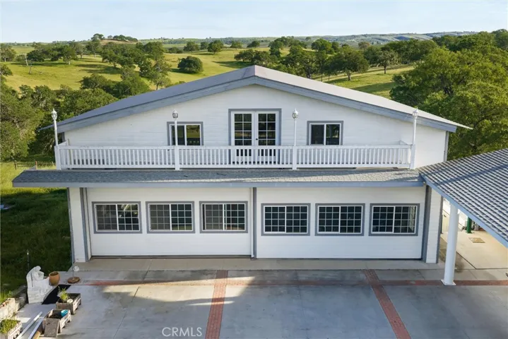 Large garage structure (1640 square foot measured) for ~8 cars, plus large storage loft accessed by commercial lift