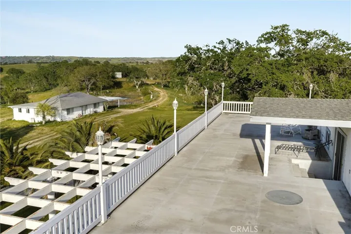 View deck on primary residence looking to the guest cottage and eastern portion of property