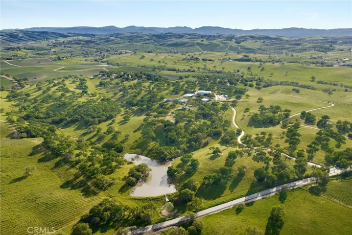 High aerial view showing entire property and beyond