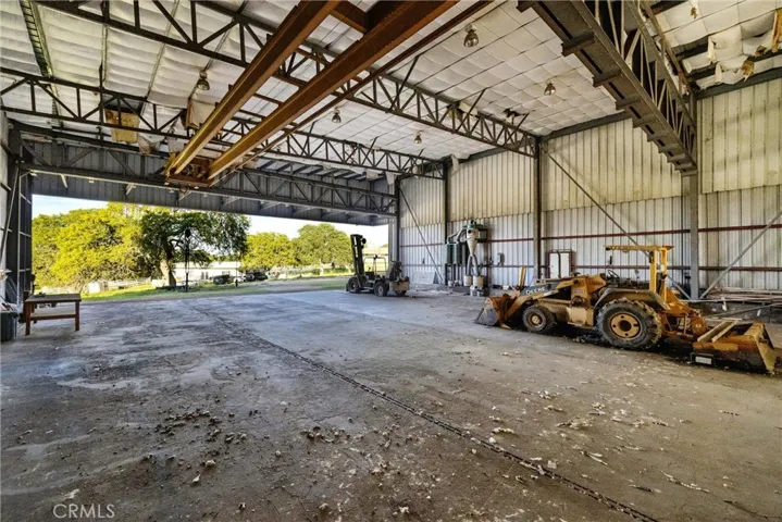 Inside of the larger warehouse building showing the open half of the building
