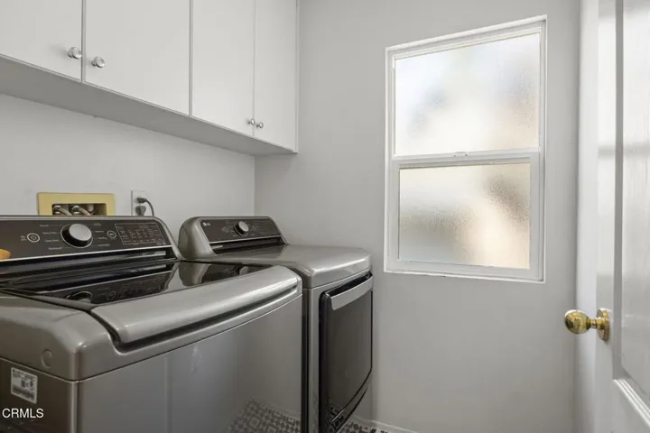 laundry room with lovely modern tile