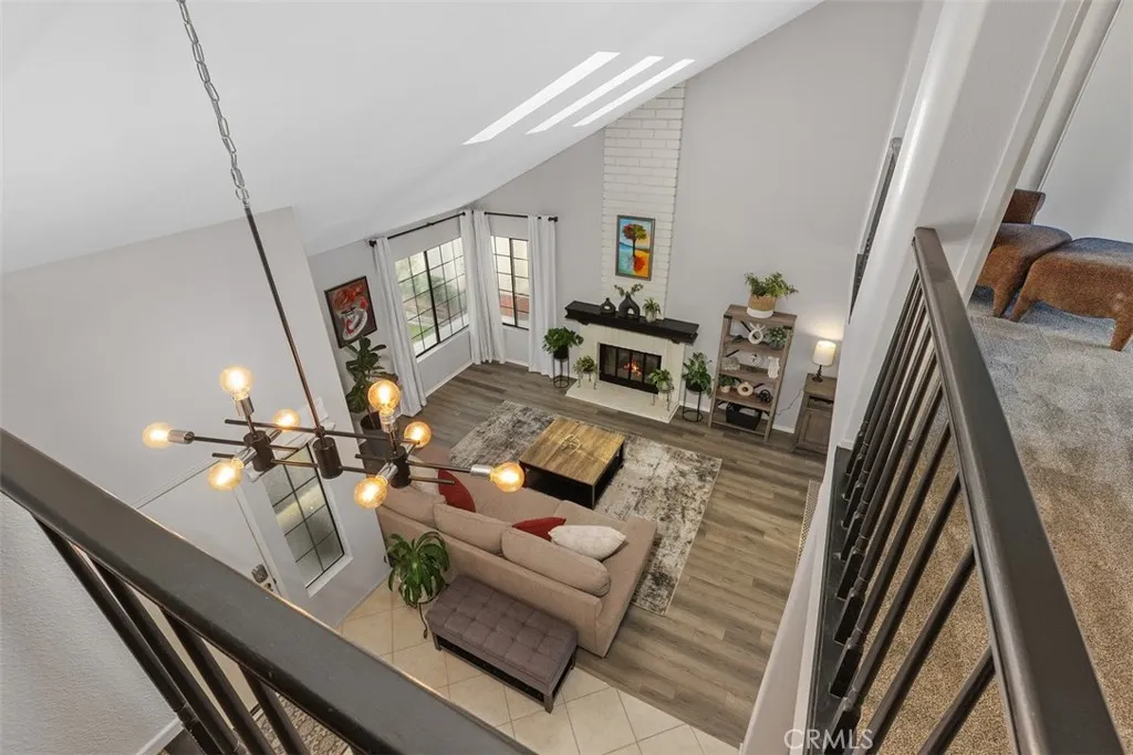 The vaulted ceiling provides a dramatic view of the living room.