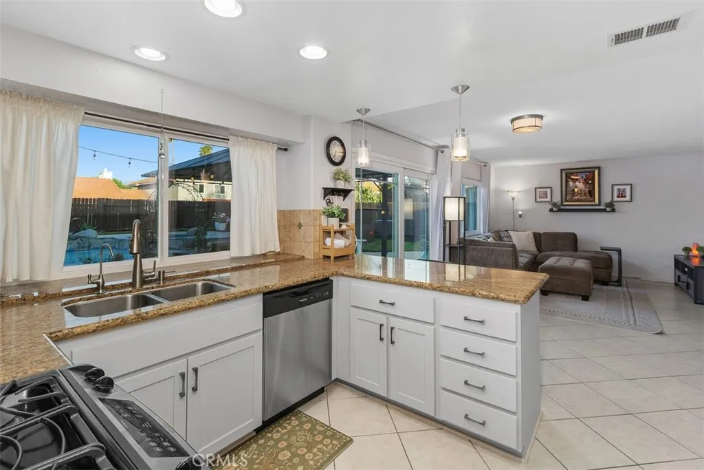 Kitchen sits next to dining area and has lovely views to that incredible backyard.