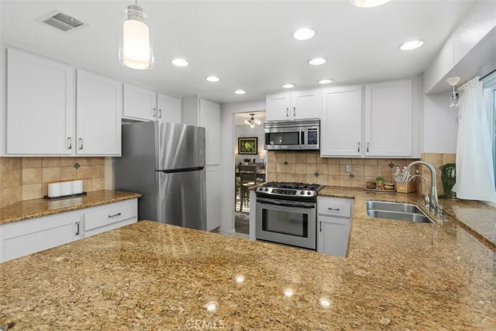Warm and sleek granite counters.