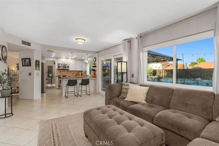A sweet family room extends everyone's favorite room: the kitchen.