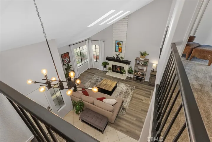 The vaulted ceiling provides a dramatic view of the living room.