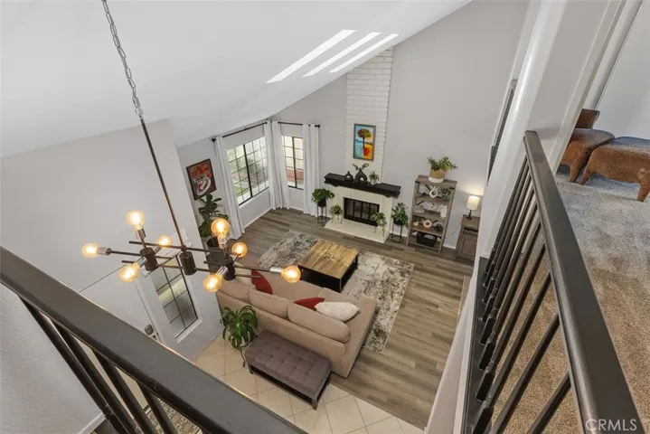 The vaulted ceiling provides a dramatic view of the living room.