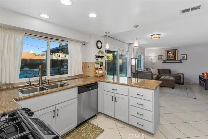 Kitchen sits next to dining area and has lovely views to that incredible backyard.