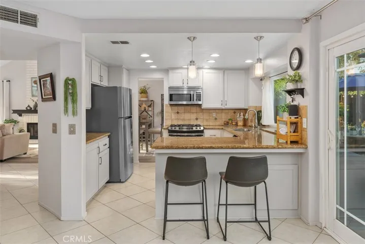 Just to the left are two spacious closets for loads of extra kitchen storage.
