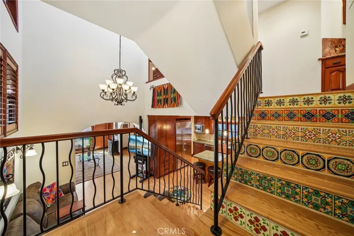 Handpicked tile accents the stairway.