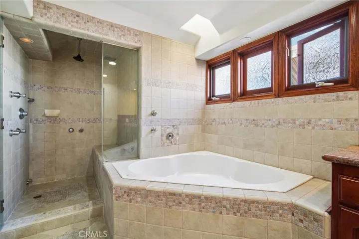 Jacuzzi tub and shower with Steam option.