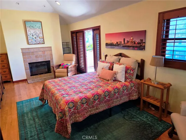Seating areas on both sides of the bedroom.