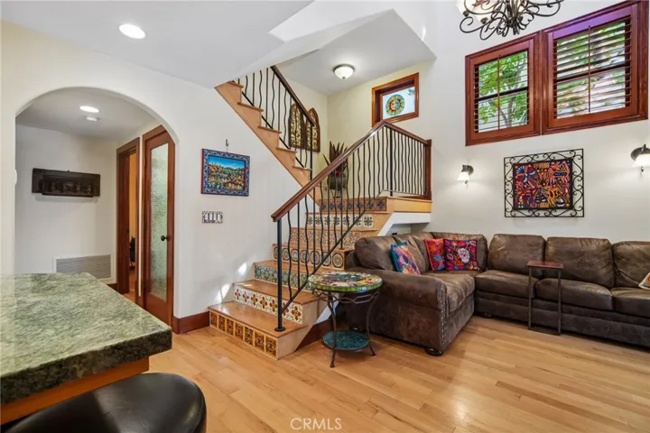 Family room with high ceilings open to the kitchen