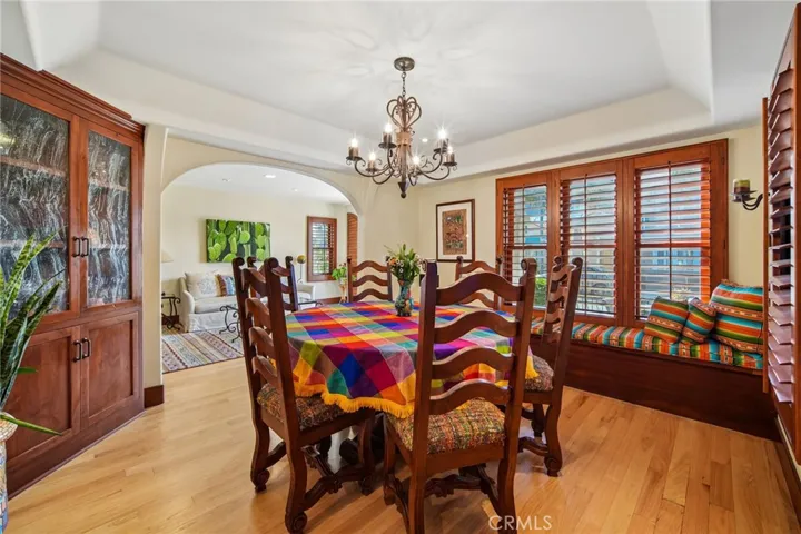 Dining room with built-ins and abundant windows.