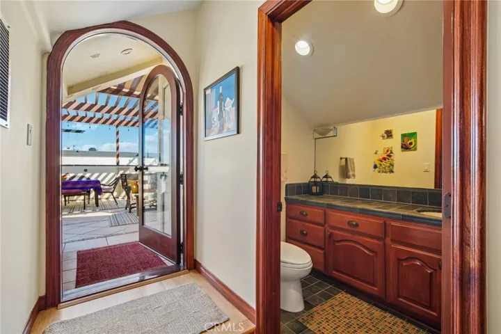 Roof top half bath and entrance to deck.