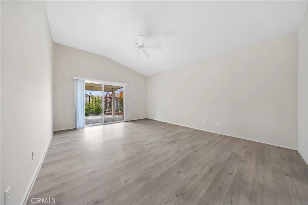 Your spacious primary bedroom has lovely LVP flooring and  plenty of  room for a sitting area.