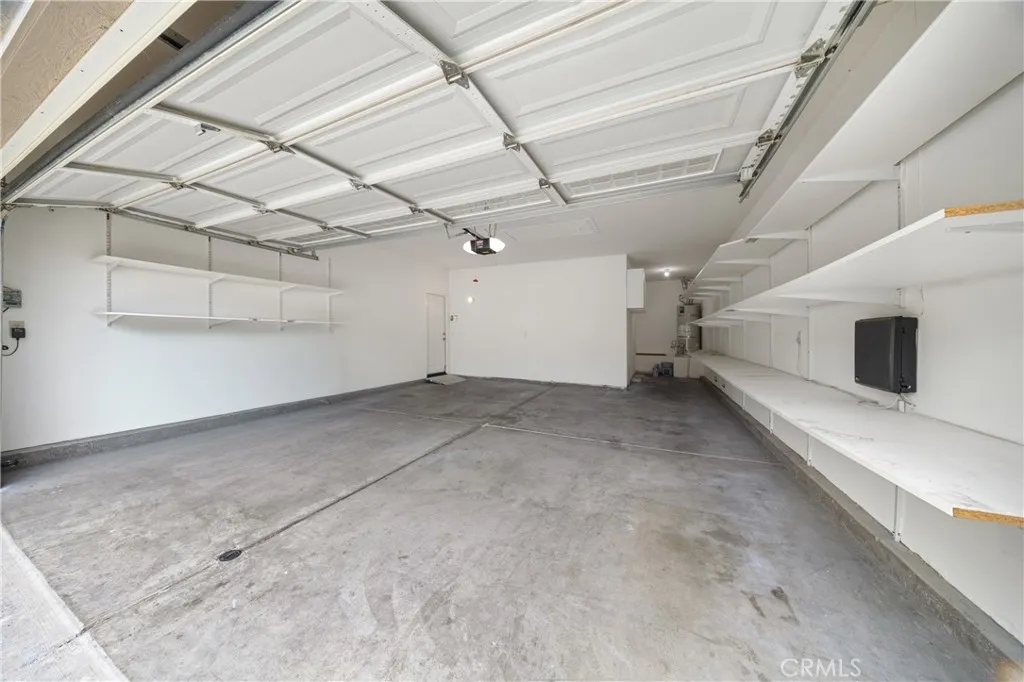 Your garage has plenty of space for 2 vehicles and there is an alcove for golf cart, workbench or storage.