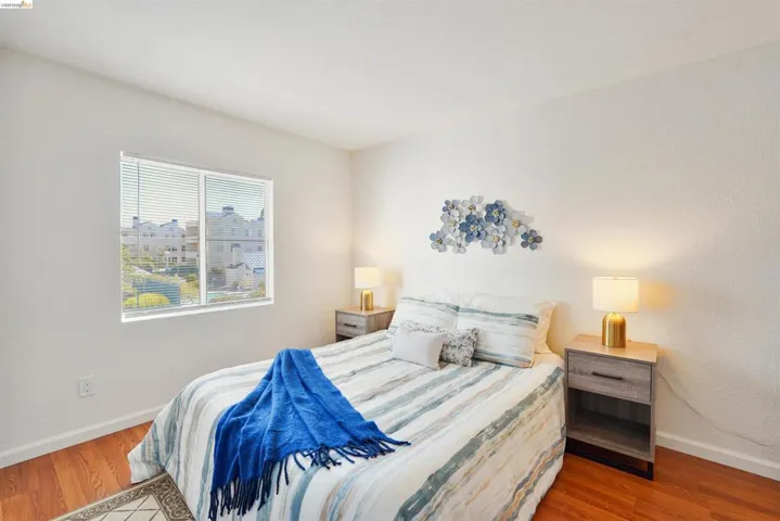Hardwood-finish flooring and white baseboards
