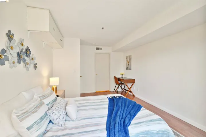 Bedroom featuring wood-finish flooring