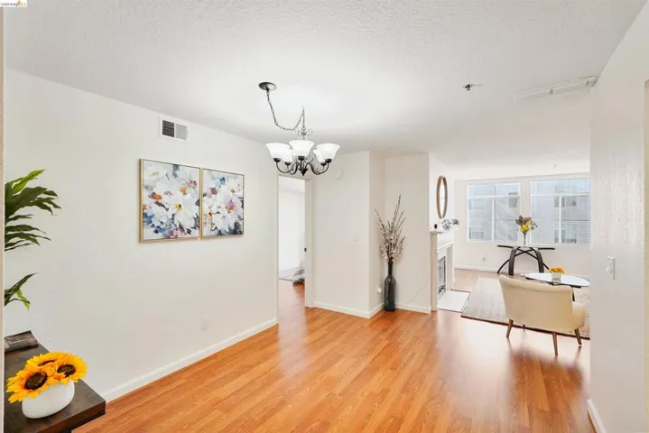 Light wood-finish flooring extending from the entry area into the main living spaces