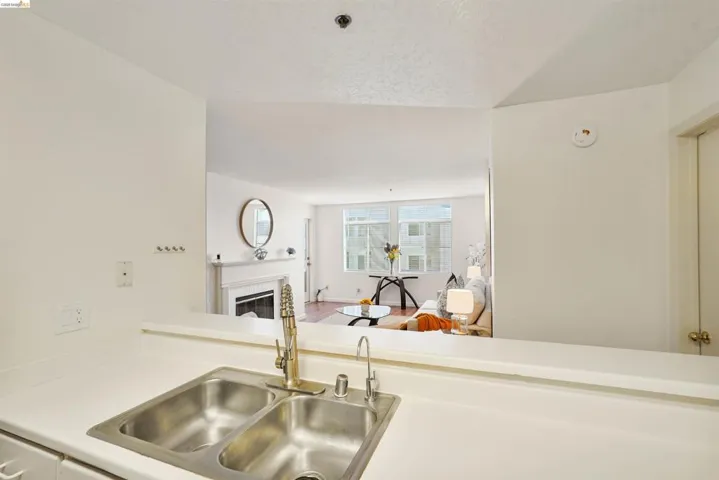 Kitchen counter with a double-basin stainless steel sink and a pull-down faucet