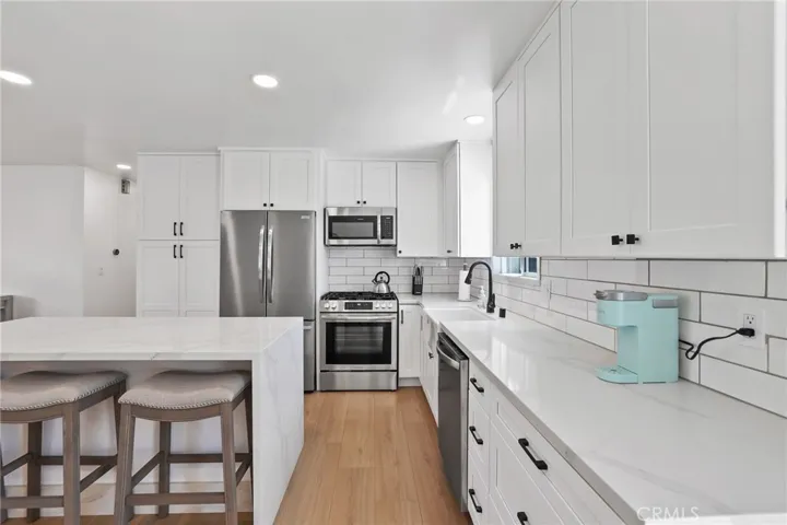 Completely remodeled kitchen with new cabinets, fixtures, appliances, walls and more.