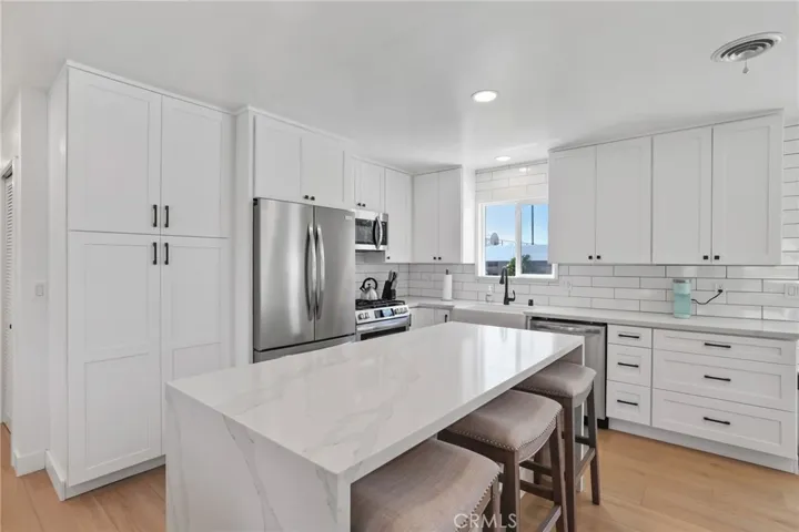 Center island with bar height seating.