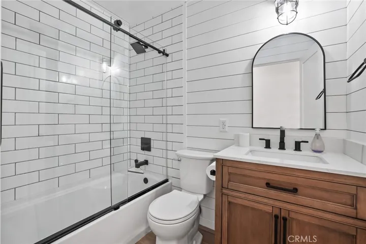 Beautifully remodeled  bath with large shower and tub.