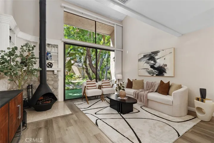 Spacious living room with large windows bringing in natural light