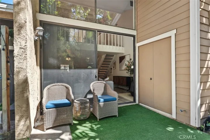 Private patio with washer and dryer inside the closet