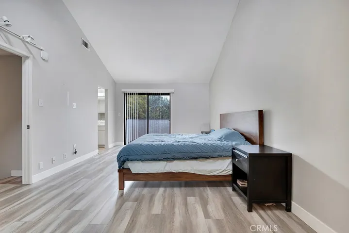 master bedroom with vaulted ceilings