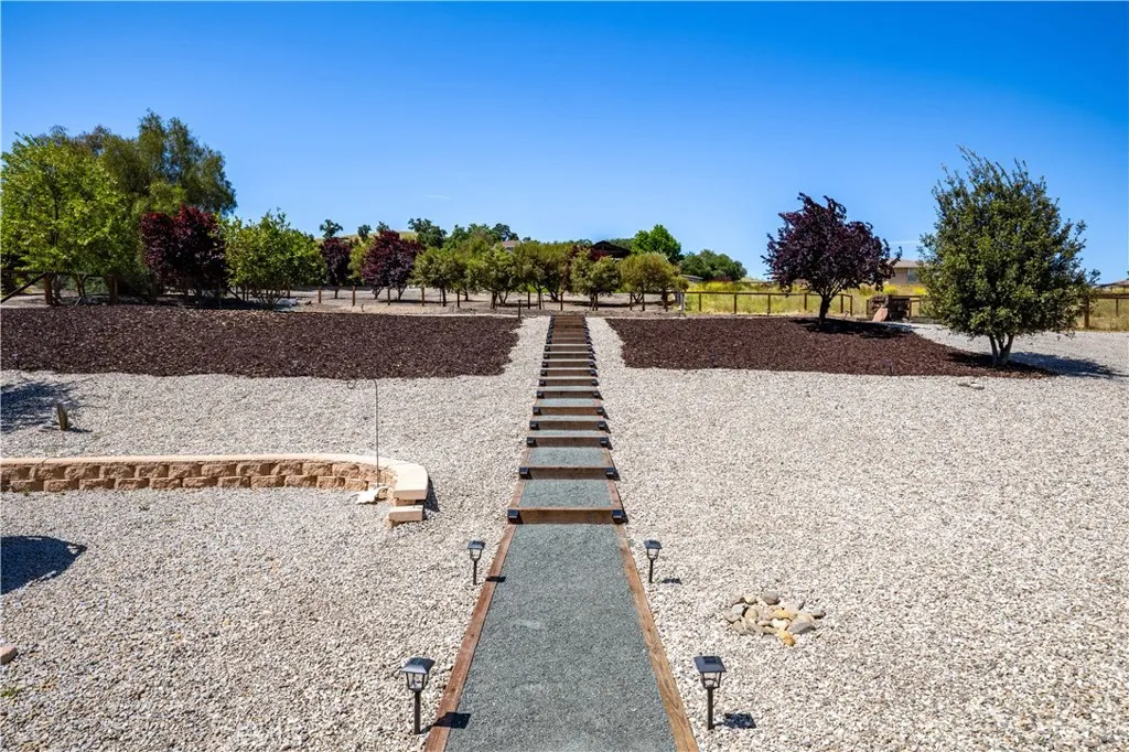 1 acre. Stairs lead from home to top of property private, views and flat for rv garage, auxiliary unit or ?
