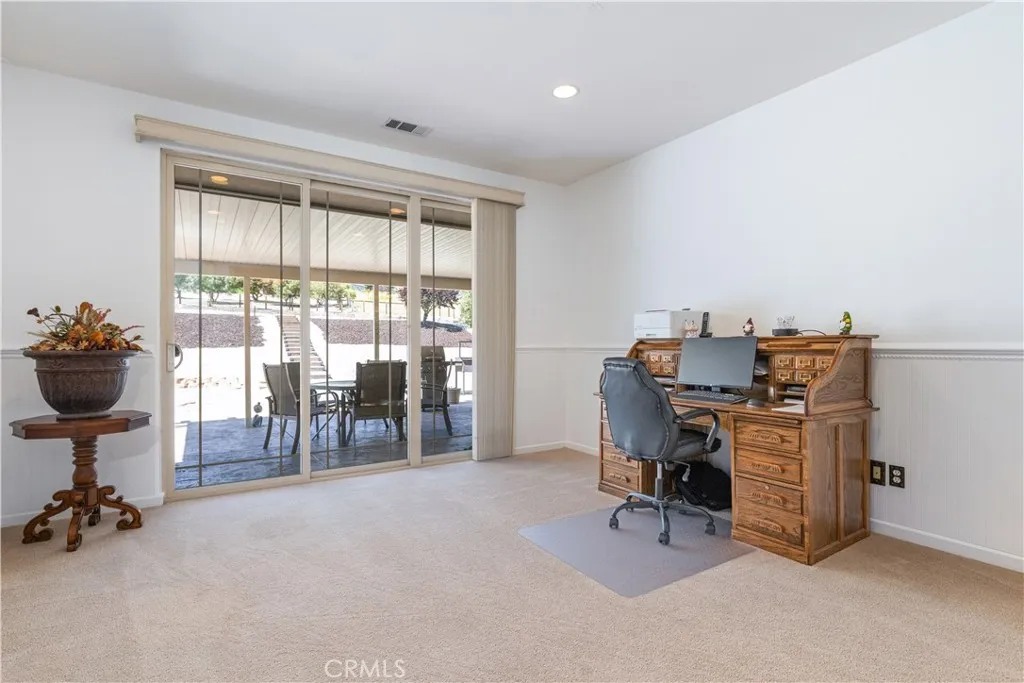 Living room currently used as temp office space