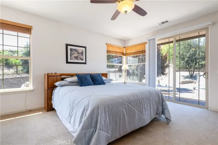 Large primary room with views and entry to outside pantio