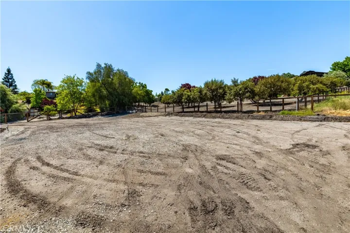 Huge flat area just above the home. Look at the privacy and pretty views. Maybe build RV garage or auxiliary home.