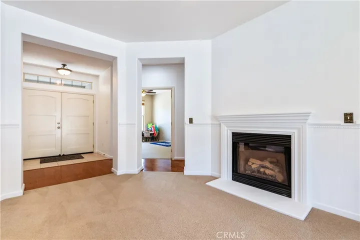 Formal living room with propane fireplace freshly painted