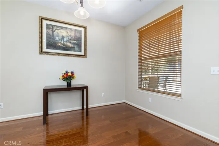 Informal dining space off the kitchen in this space light would center over full size table which they had here.