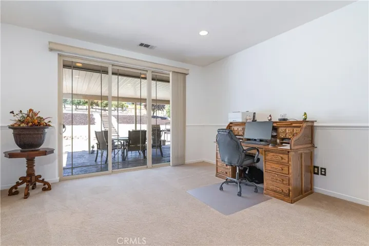 Living room currently used as temp office space