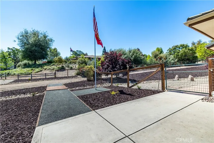 Such a cute bridgeway across front of property to second driveway